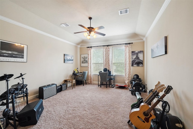 workout room featuring carpet floors, a raised ceiling, visible vents, and ornamental molding