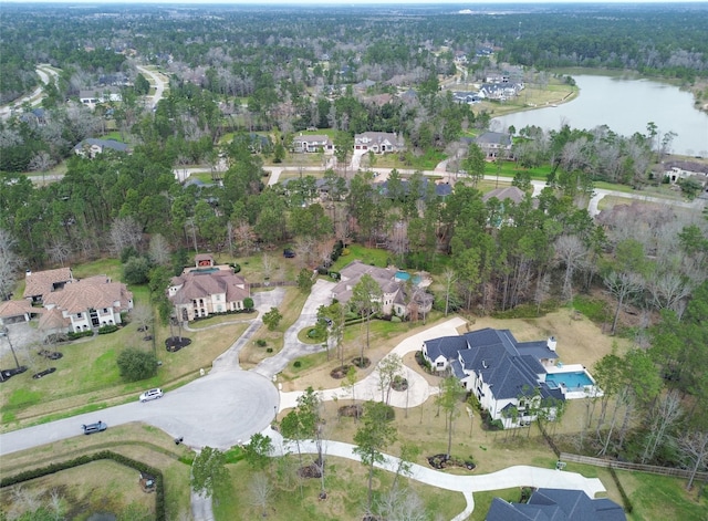 drone / aerial view featuring a water view and a residential view