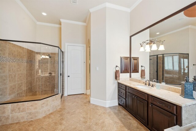 full bathroom featuring ornamental molding, a shower stall, baseboards, and vanity