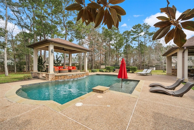 outdoor pool featuring a patio area, ceiling fan, outdoor lounge area, and a gazebo