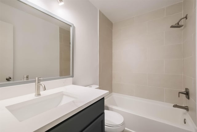 bathroom featuring toilet,  shower combination, and vanity