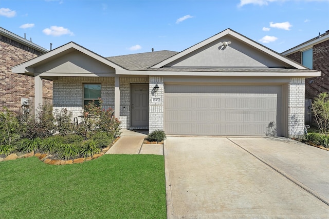 single story home with a garage, concrete driveway, brick siding, and a front lawn