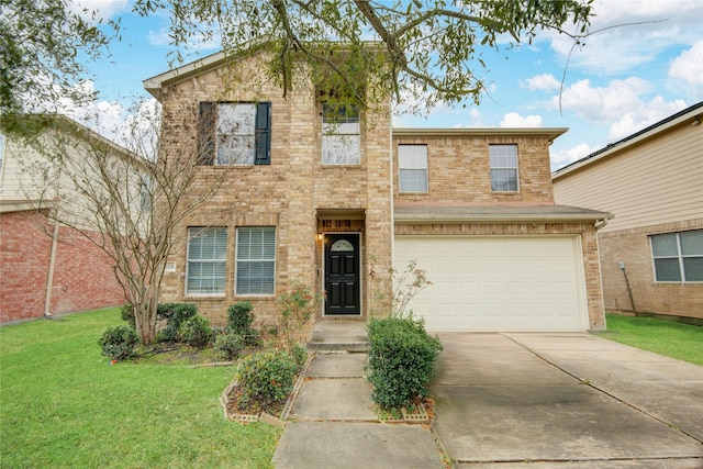 traditional home featuring brick siding, a front yard, an attached garage, and driveway