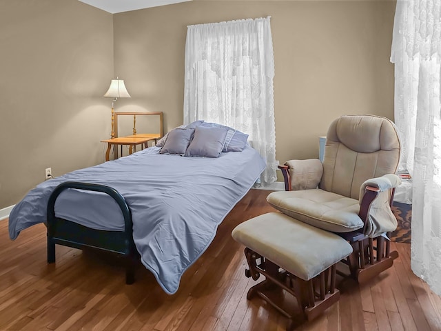 bedroom featuring hardwood / wood-style flooring