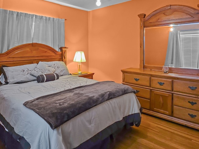 bedroom featuring wood finished floors