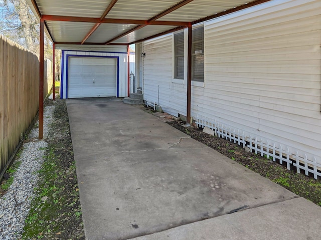 view of home's exterior featuring fence and a carport