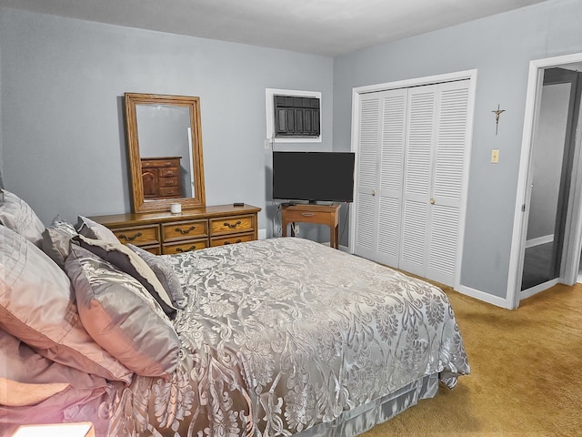 bedroom with baseboards, a closet, and light colored carpet