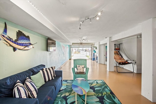 living area with concrete flooring