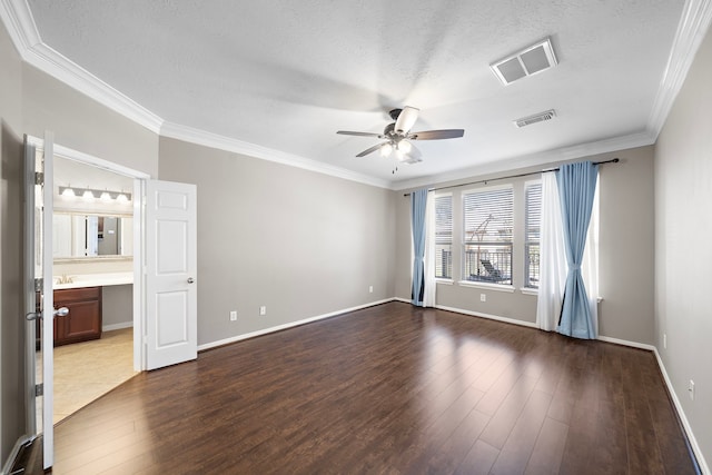 unfurnished room with dark wood-style floors, visible vents, and a ceiling fan