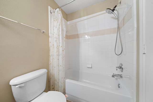 full bathroom featuring shower / tub combo with curtain and toilet