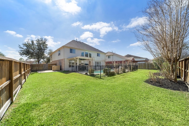 back of house with a patio, a fenced backyard, brick siding, a pool, and a lawn