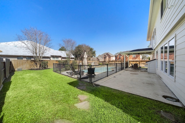 view of yard with a fenced backyard, a fenced in pool, and a patio