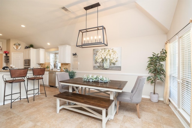 dining room with recessed lighting, visible vents, vaulted ceiling, and baseboards