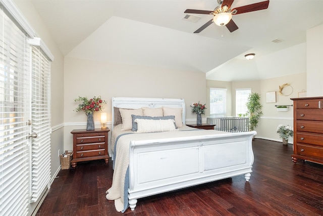 bedroom featuring lofted ceiling, a ceiling fan, visible vents, and wood finished floors