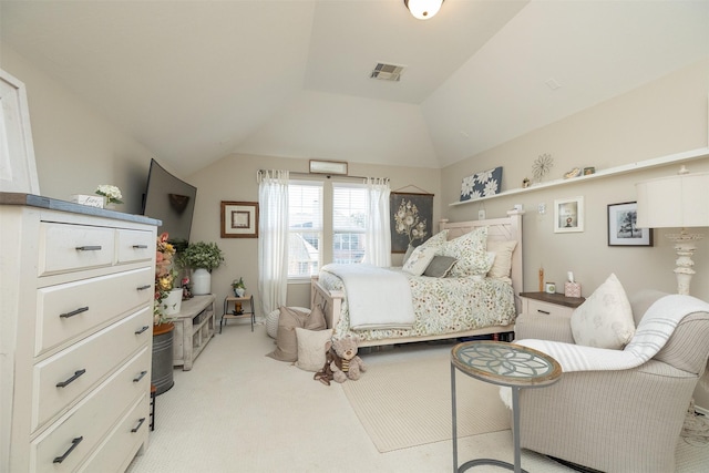 bedroom with light colored carpet, visible vents, and vaulted ceiling