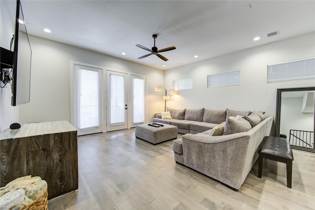 living area with a ceiling fan, recessed lighting, visible vents, and light wood-style flooring