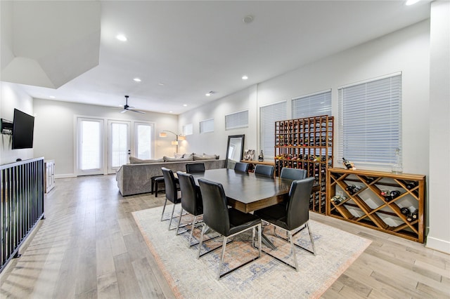 dining area featuring light wood-style floors, recessed lighting, baseboards, and a ceiling fan