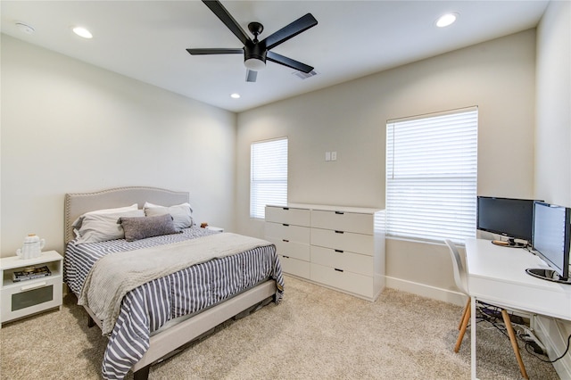 carpeted bedroom featuring baseboards, visible vents, a ceiling fan, and recessed lighting