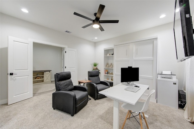 office featuring ceiling fan, recessed lighting, visible vents, and light colored carpet