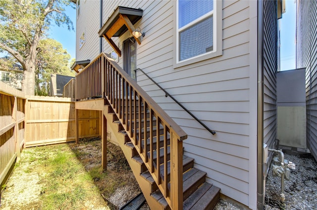 entrance to property featuring fence