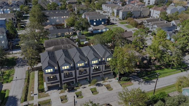 birds eye view of property with a residential view