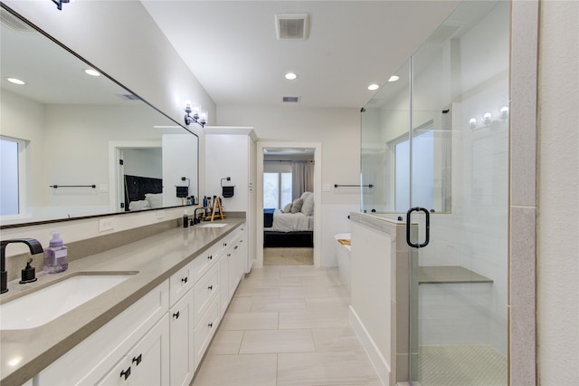 full bath with visible vents, a sink, a shower stall, and ensuite bath