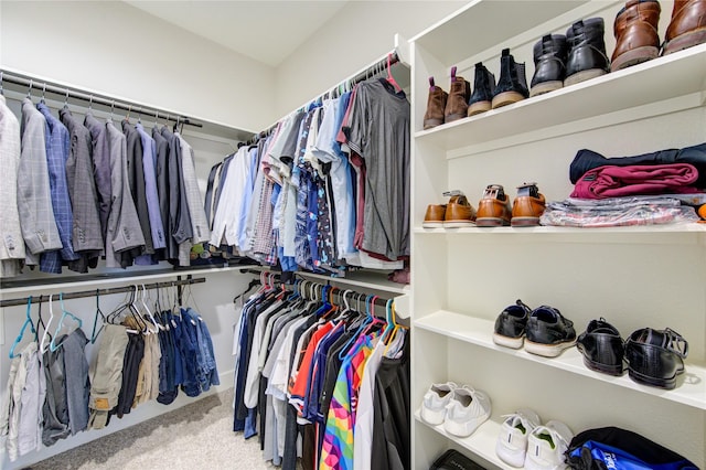 walk in closet with carpet floors