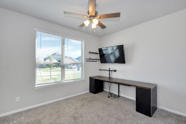 office area with carpet floors, ceiling fan, and baseboards