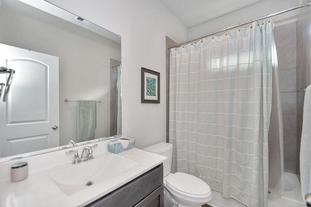 bathroom with visible vents, shower / tub combo with curtain, vanity, and toilet