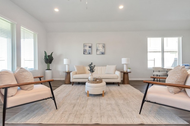 living room featuring recessed lighting, baseboards, and wood finished floors