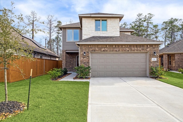 view of front of property with driveway, brick siding, a front lawn, and fence