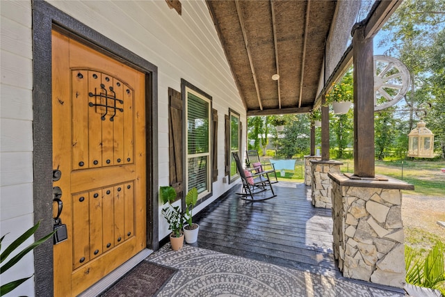 property entrance with covered porch