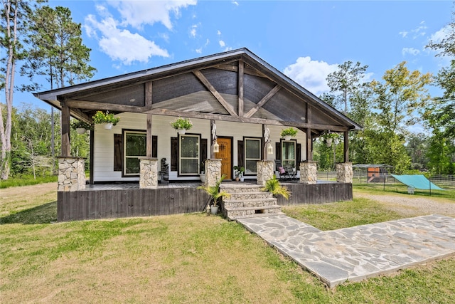 view of front of house featuring a front yard and covered porch