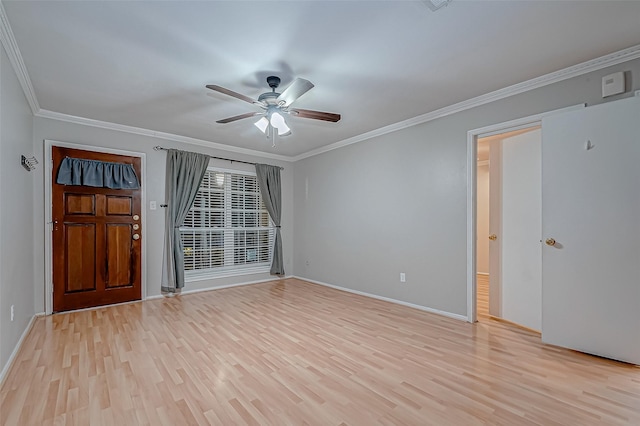 interior space featuring ceiling fan, baseboards, light wood-style flooring, and crown molding