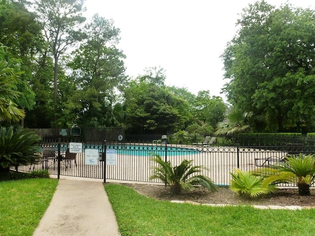 community pool featuring fence