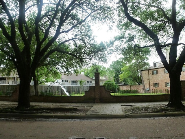 surrounding community with a fenced front yard