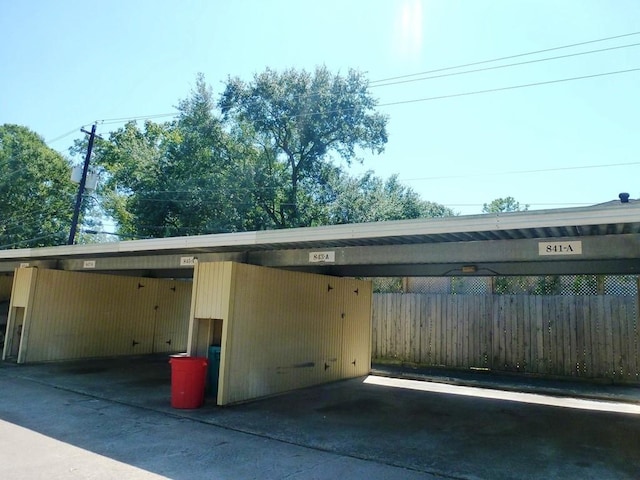 covered parking lot with fence