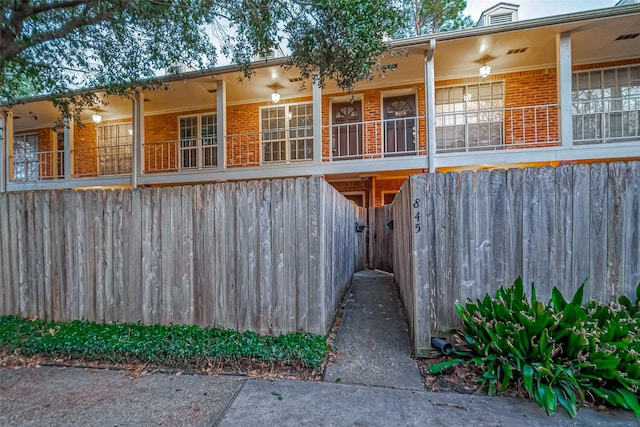 exterior space featuring brick siding