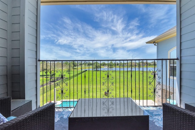 balcony featuring a water view