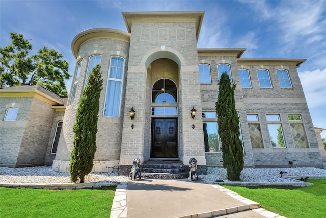 view of front of home with brick siding