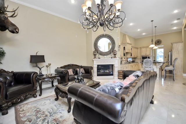 living room with recessed lighting, a glass covered fireplace, and crown molding