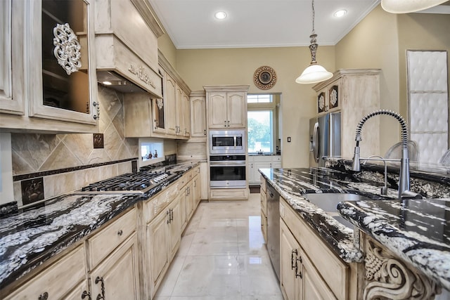 kitchen featuring light brown cabinets, appliances with stainless steel finishes, ornamental molding, decorative backsplash, and dark stone counters