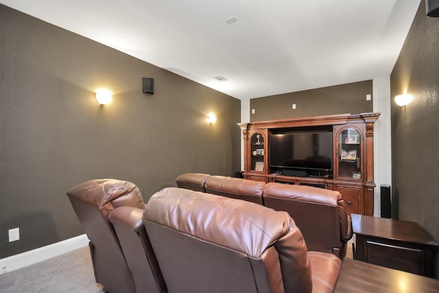 cinema featuring carpet floors, visible vents, and baseboards