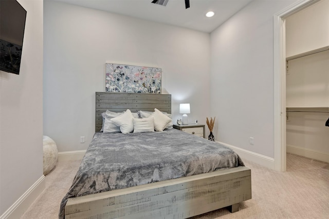 carpeted bedroom featuring recessed lighting, visible vents, a spacious closet, and baseboards