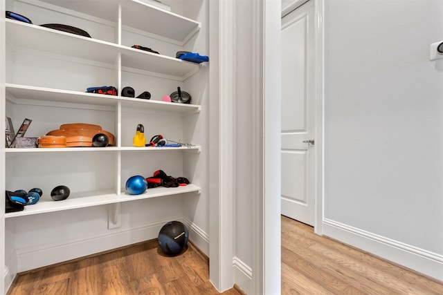 interior details featuring wood finished floors and baseboards