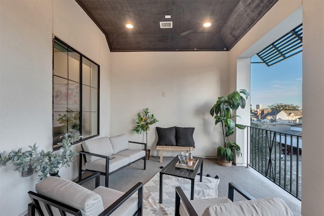 balcony with outdoor lounge area and visible vents