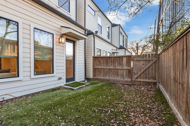 view of yard with a fenced backyard