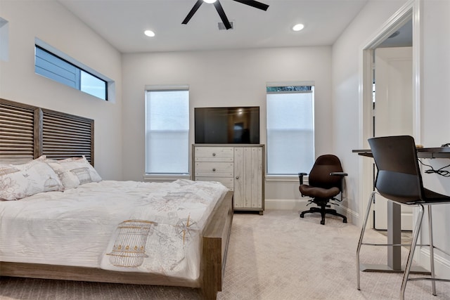 bedroom featuring recessed lighting, light colored carpet, ceiling fan, and baseboards