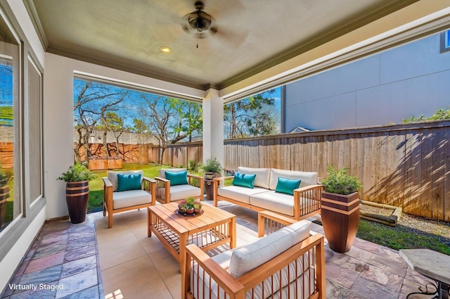 view of patio / terrace with a fenced backyard, ceiling fan, and an outdoor living space