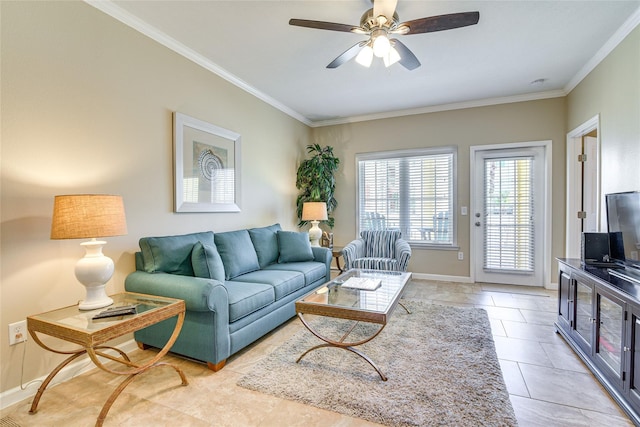 living room featuring light tile patterned floors, baseboards, a ceiling fan, and crown molding